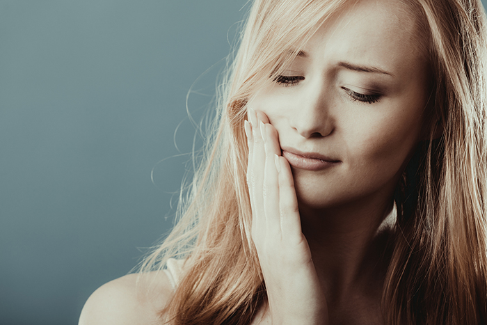 woman with tooth sensitivity